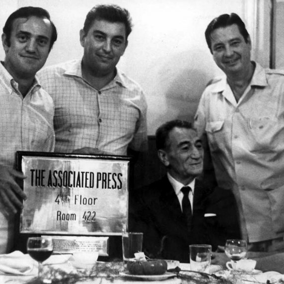 Three AP legends (standing left to right: Peter Arnett, Horst Faas, George MacArthur)