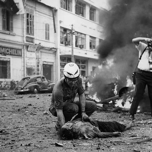 Faas photographs victim of Saigon street attack, circa 1963