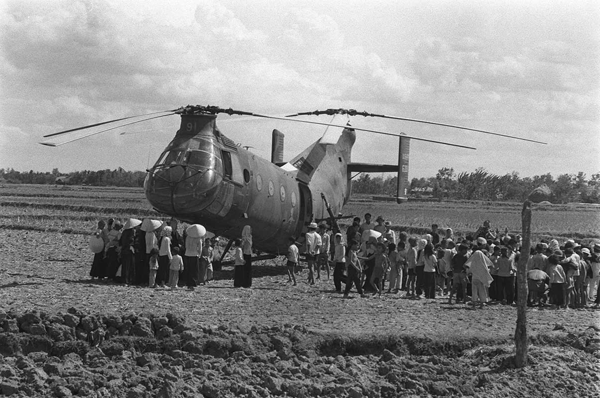 Vietnamese civilians board H-21 helicopter – early 1960's